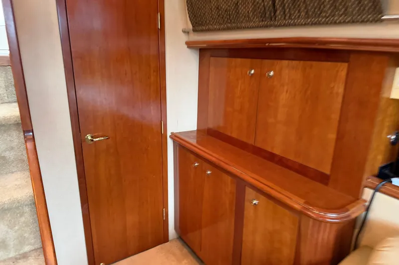 Slide: The Image of Interior of 2003 Cruisers Yachts 405 Express Motoryacht with wooden cabinetry and door. - 50