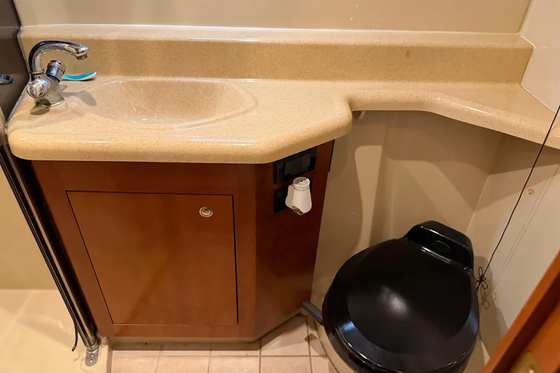 Slide: The Image of Bathroom interior of 2003 Cruisers Yachts 405 Express Motoryacht with sink and toilet. - 58