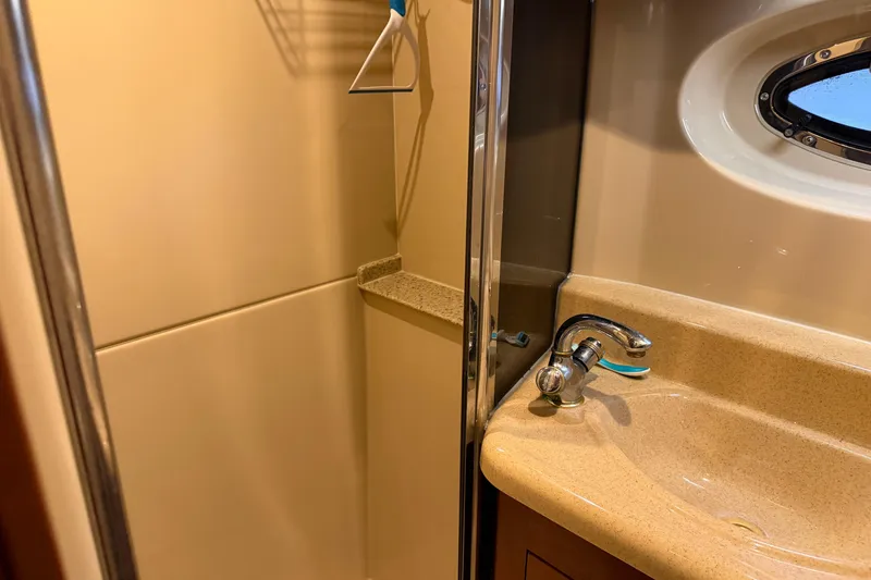 Slide: The Image of Bathroom interior of 2003 Cruisers Yachts 405 Express Motoryacht with sink and porthole. - 59