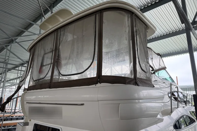 Slide: The Image of 2003 Cruisers Yachts 405 Express Motoryacht docked in marina. - 6