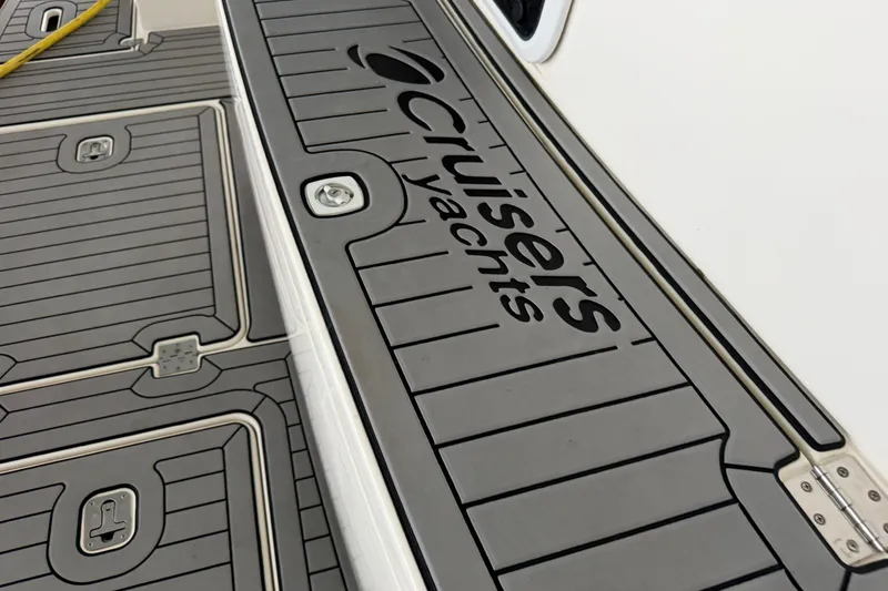 Slide: The Image of Deck of 2003 Cruisers Yachts 405 Express Motoryacht with logo and textured surface. - 8
