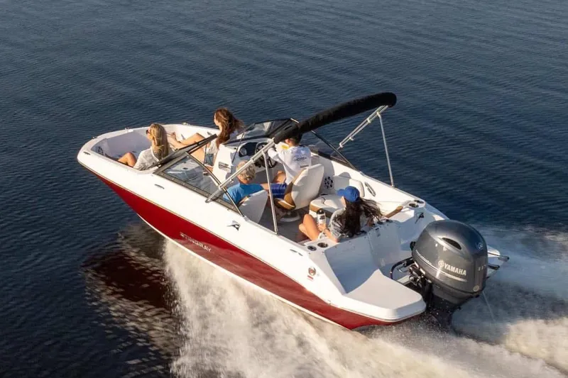 Slide: The Image of Manufacturer Provided Image: 2026 Stingray 191 DC boat cruising on open water with passengers. - 2