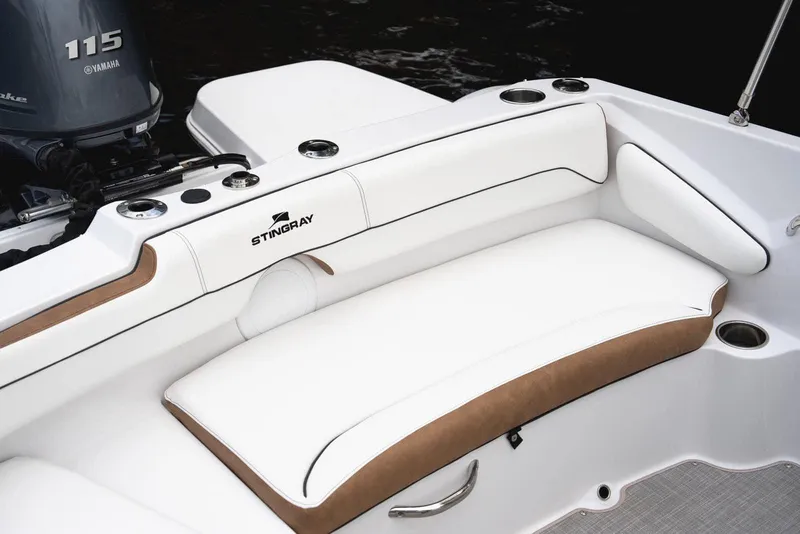 Slide: The Image of Manufacturer Provided Image: 2026 Stingray 191 DC boat interior with white seating and Yamaha 115 engine. - 8