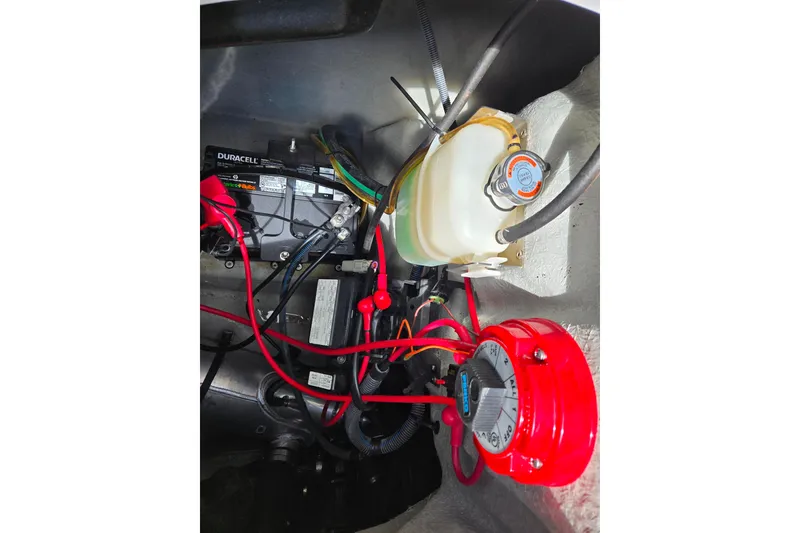 Slide: The Image of Engine compartment of 2011 Sea-Doo 180 Challenger SE with battery and wiring. - 12