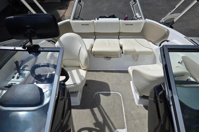 Slide: The Image of 2011 Sea-Doo 180 Challenger SE interior with beige seating and steering console. - 13