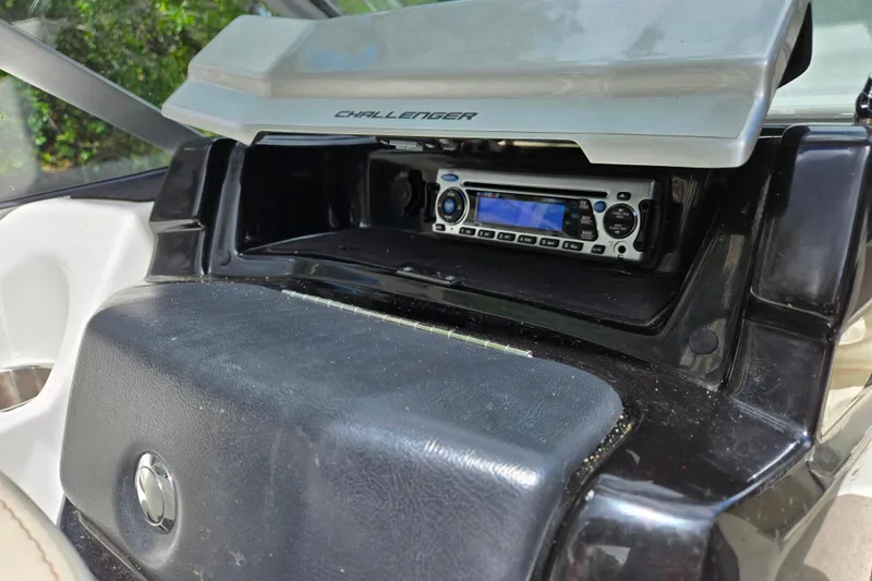 Slide: The Image of 2011 Sea-Doo 180 Challenger SE dashboard with stereo system and storage compartment. - 15
