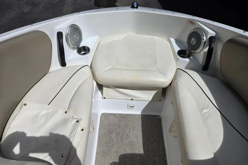 Slide: The Image of Interior of 2011 Sea-Doo 180 Challenger SE boat with white seating and speakers. - 16