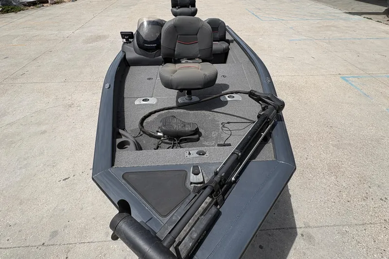 Slide: The Image of 2022 Tracker Pro Team 175 boat with seating and fishing equipment on deck. - 11