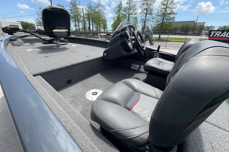 Slide: The Image of 2022 Tracker Pro Team 175 boat interior with gray seating and steering console. - 18