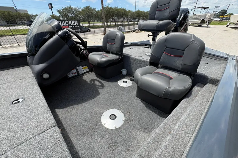 Slide: The Image of 2022 Tracker Pro Team 175 boat interior with gray seating and steering console. - 19