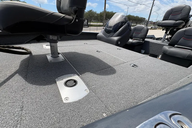 Slide: The Image of 2022 Tracker Pro Team 175 boat interior with seating and carpeted deck. - 20