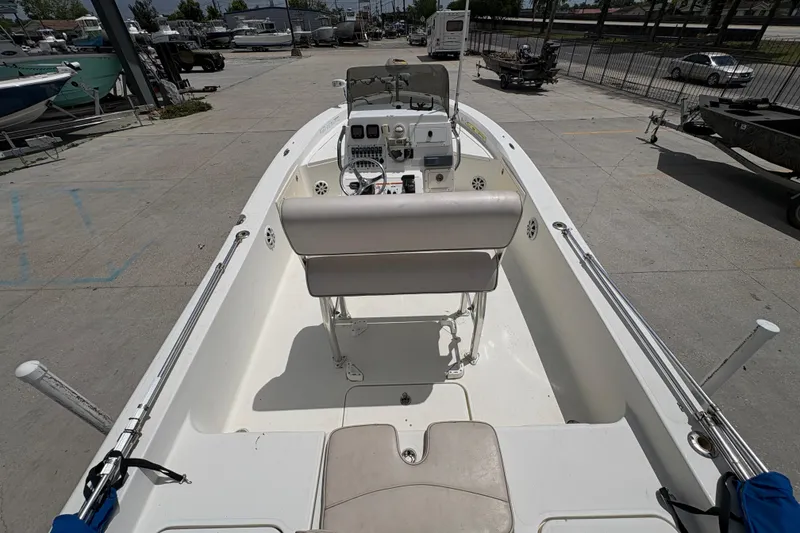 Slide: The Image of 2008 Hydra-Sports Bay Bolt 23 boat interior with console and seating, parked outdoors. - 10