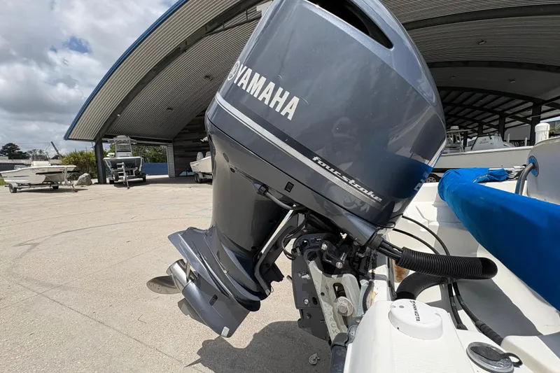 Slide: The Image of 2008 Hydra-Sports Bay Bolt 23 with Yamaha four-stroke outboard motor in marina setting. - 22