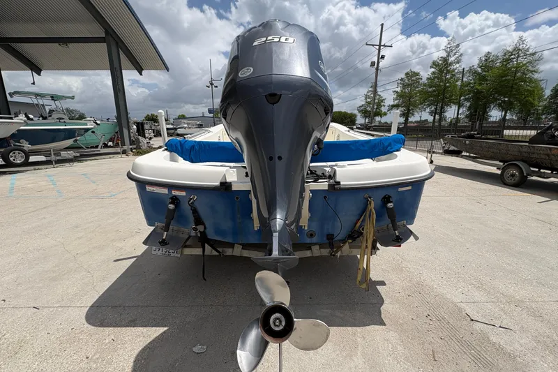 Slide: The Image of 2008 Hydra-Sports Bay Bolt 23 boat with powerful outboard motor in a marina setting. - 4