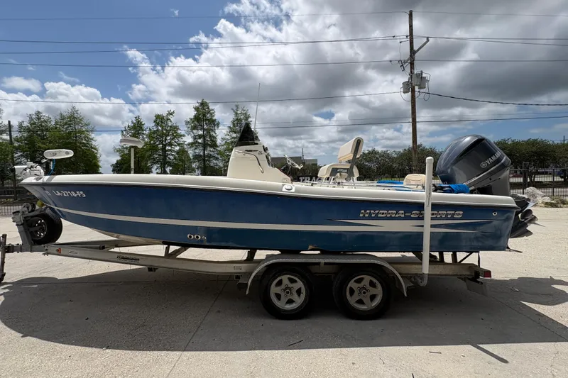 Slide: The Image of 2008 Hydra-Sports Bay Bolt 23 boat on trailer, blue hull, Yamaha outboard motor. - 6