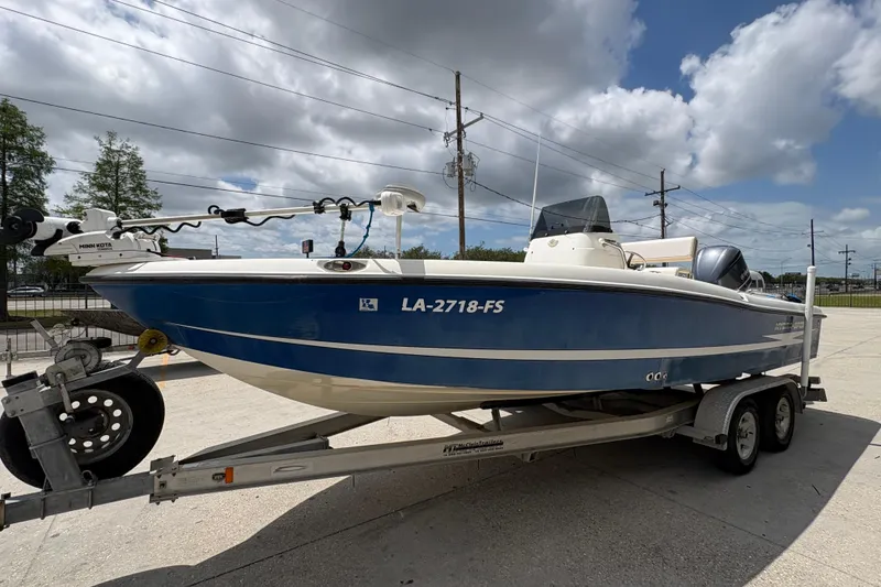 Slide: The Image of 2008 Hydra-Sports Bay Bolt 23 boat on trailer, parked outdoors under cloudy sky. - 7