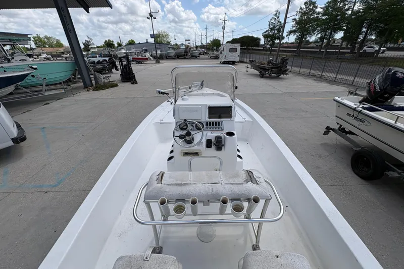 Slide: The Image of Open deck of a 2010 Blazer Bay 2020 boat, parked in a marina. - 12