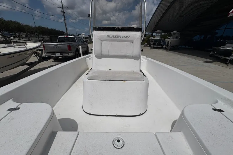 Slide: The Image of Open deck of a 2010 Blazer Bay 2020 boat, parked outdoors. - 19