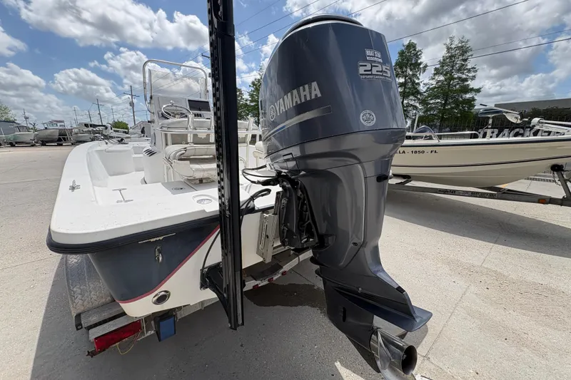 Slide: The Image of Blazer Bay 2020 boat with Yamaha 225 engine, parked outdoors under a cloudy sky. - 20
