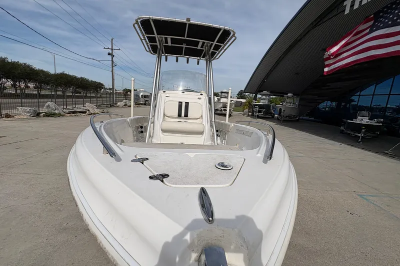 Slide: The Image of 2014 Glasstream 192 CC boat with T-top, parked outdoors near dealership. - 11