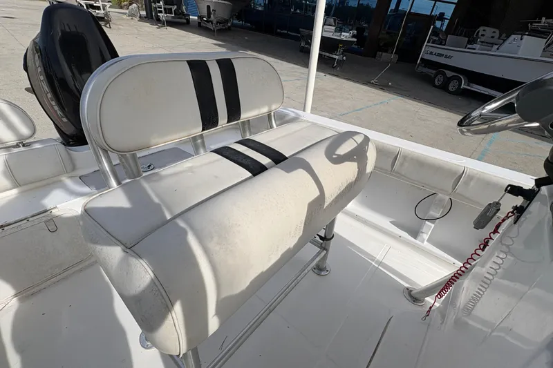 Slide: The Image of 2014 Glasstream 192 CC boat interior with white seating and steering wheel. - 13
