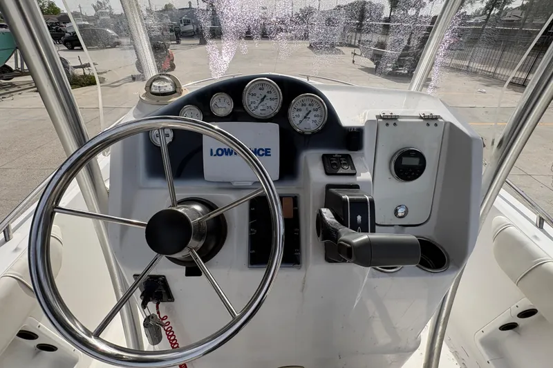 Slide: The Image of 2014 Glasstream 192 CC boat dashboard with steering wheel and gauges. - 14