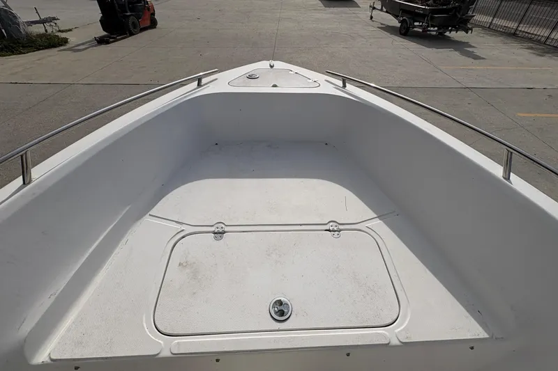 Slide: The Image of 2014 Glasstream 192 CC boat deck, spacious and clean, with storage compartment. - 17