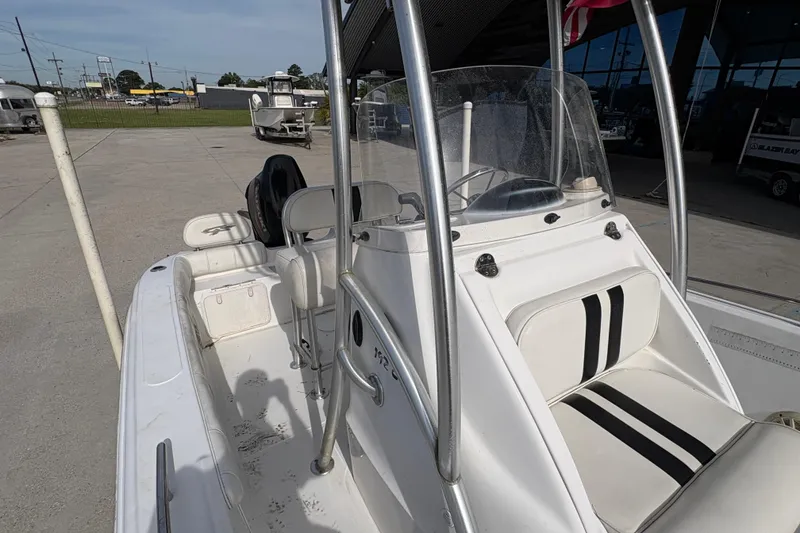 Slide: The Image of 2014 Glasstream 192 CC boat with white seating and console, parked outdoors. - 19