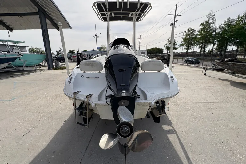 Slide: The Image of 2014 Glasstream 192 CC boat with outboard motor, parked outdoors. - 5