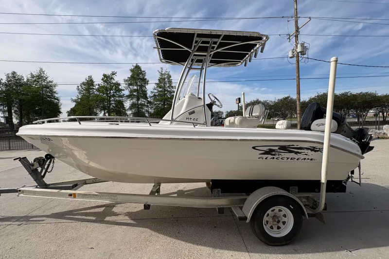 Slide: The Image of 2014 Glasstream 192 CC boat on trailer, parked outdoors under clear sky. - 7