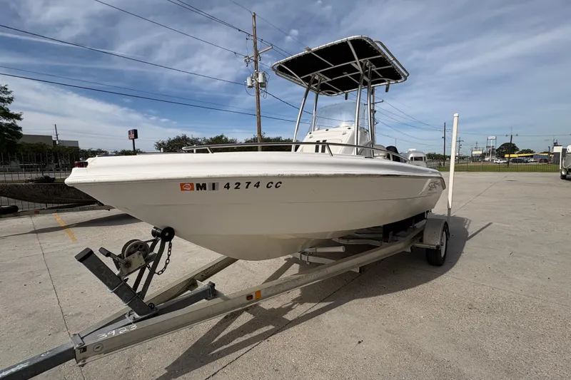Slide: The Image of 2014 Glasstream 192 CC boat on trailer in parking lot, under clear sky. - 8