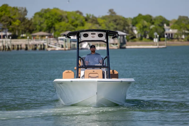 Slide: The Image of 2025 Sea Pro 202 Center Console boat cruising on a calm lake. - 6