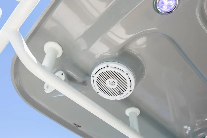 Slide: The Image of 2022 Pioneer 202 Islander boat speaker and light detail against blue sky. - 23