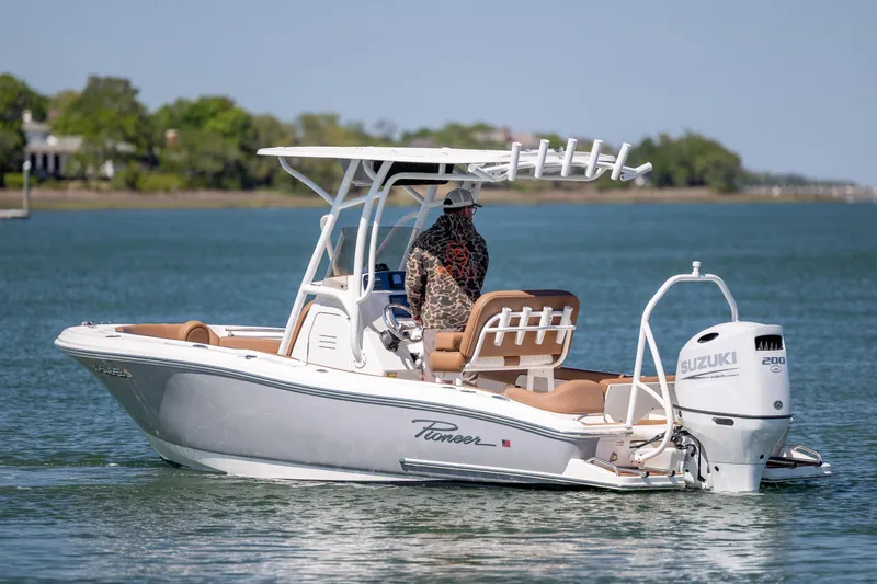 Slide: The Image of 2022 Pioneer 202 Islander boat with Suzuki engine on calm water. - 8