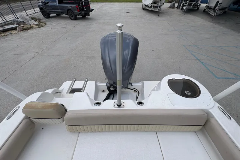 Slide: The Image of 2015 Sea Fox 249 Avenger boat stern with motor and seating area. - 11