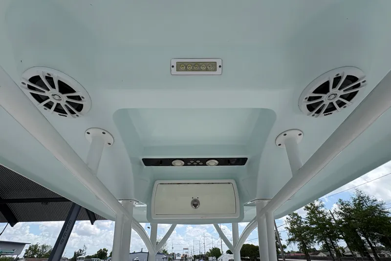 Slide: The Image of 2015 Sea Fox 249 Avenger boat interior ceiling with speakers and lighting. - 14