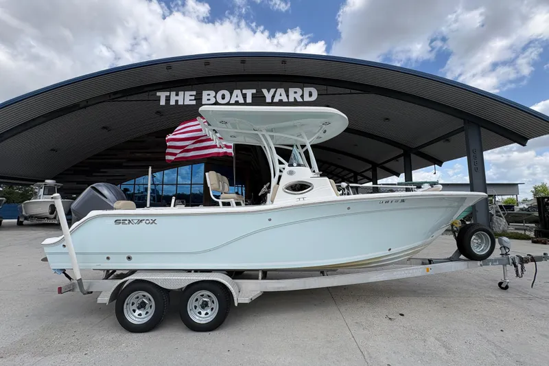 Slide: The Image of 2015 Sea Fox 249 Avenger boat on trailer at The Boat Yard dealership. - 2