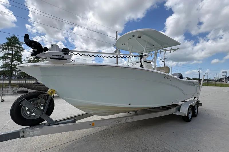 Slide: The Image of 2015 Sea Fox 249 Avenger boat on trailer under cloudy sky. - 7