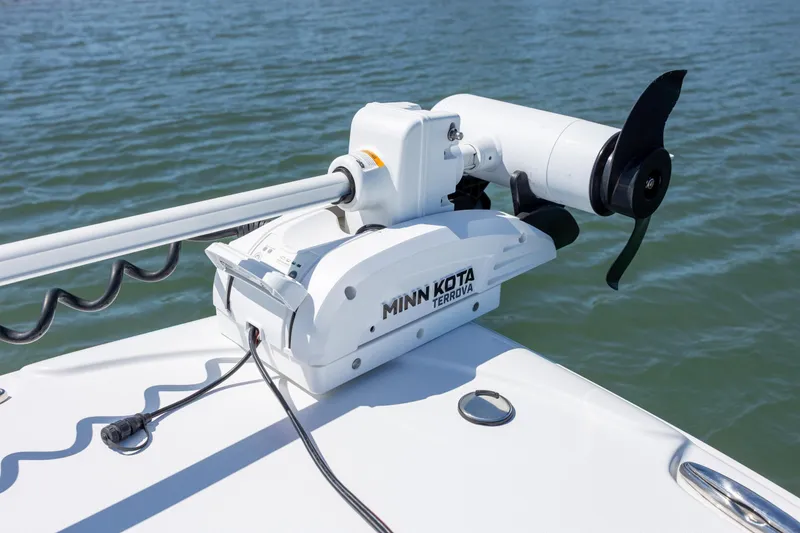 Slide: The Image of Minn Kota Terrova trolling motor on 2024 Sea Hunt Ultra 234 boat, on calm water. - 14