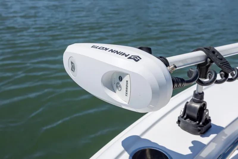 Slide: The Image of Minn Kota Terrova trolling motor on 2024 Sea Hunt Ultra 234 boat, over water. - 15