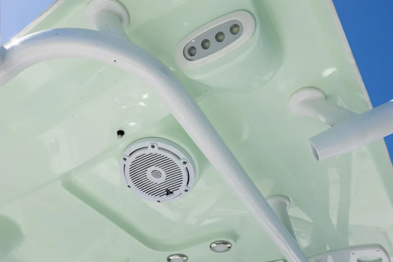 Slide: The Image of 2024 Sea Hunt Ultra 234 boat interior ceiling with speaker and lighting fixtures. - 29