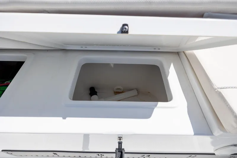 Slide: The Image of Open storage compartment on 2024 Sea Hunt Ultra 234 boat. - 32