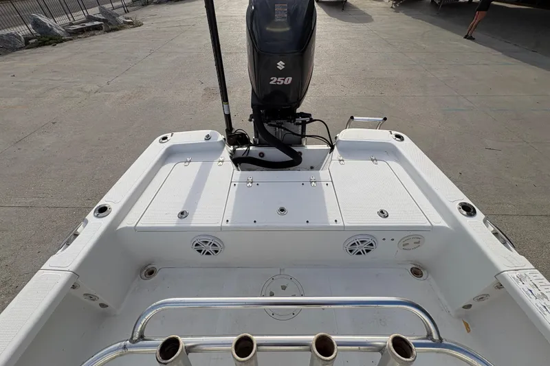 Slide: The Image of 2012 BlackJack 224 boat with Suzuki 250 engine, featuring spacious deck and rod holders. - 16