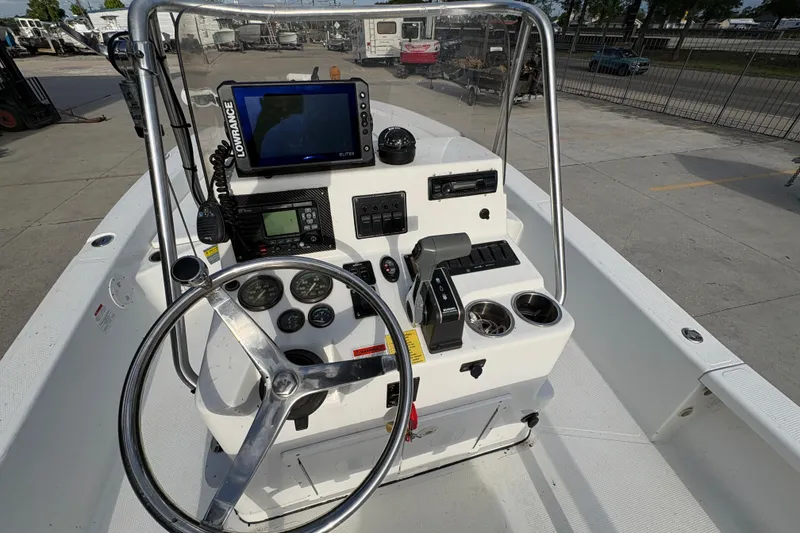 Slide: The Image of Steering console of a 2012 BlackJack 224 boat with navigation equipment. - 18
