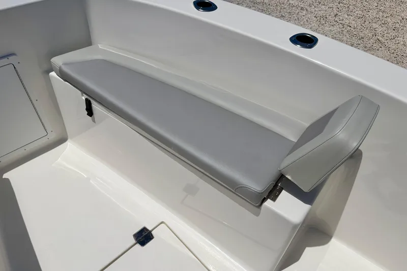 Slide: The Image of 2026 Bay Rider 21 Offshore boat seat with gray cushion and white interior. - 11