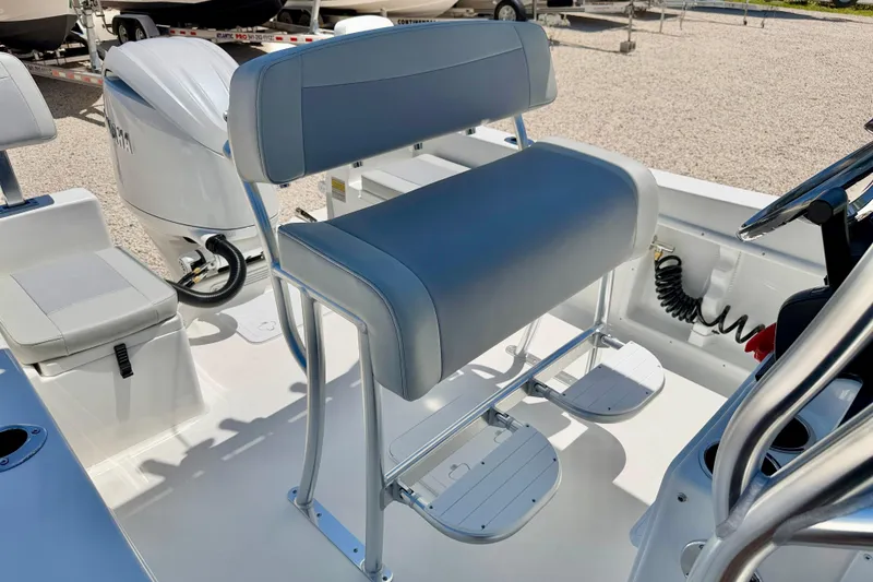 Slide: The Image of Bay Rider 21 Offshore 2026 boat interior with cushioned seating and steering console. - 14