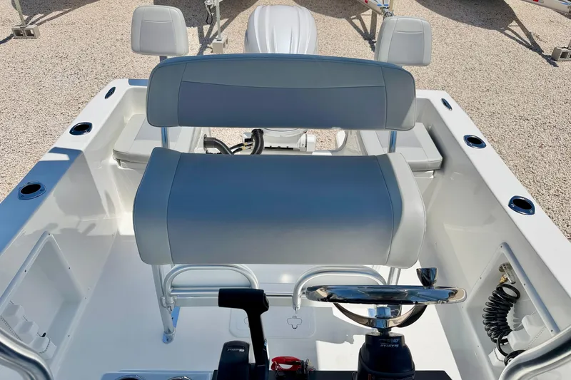 Slide: The Image of 2026 Bay Rider 21 Offshore boat interior with steering wheel and seating. - 15