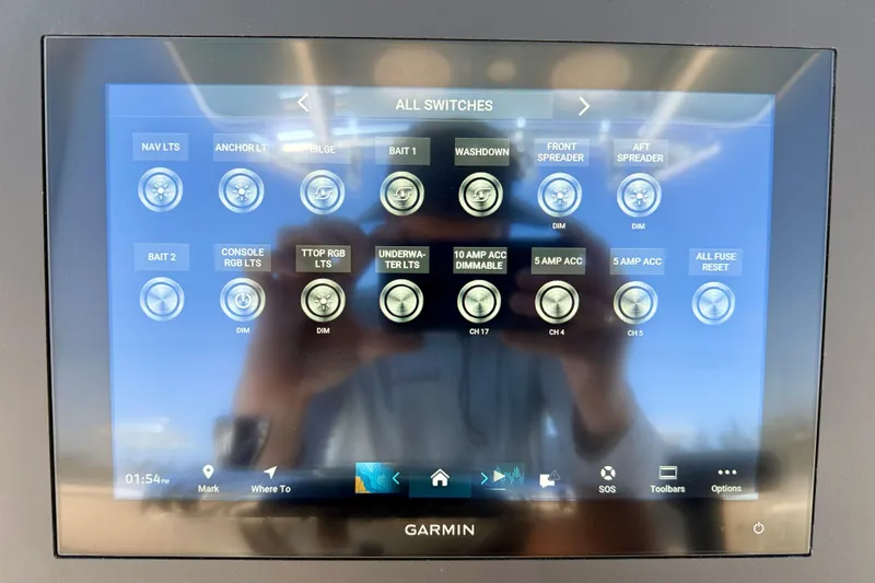 Slide: The Image of Garmin touchscreen displaying boat switch controls on a 2026 Bay Rider 21 Offshore. - 17