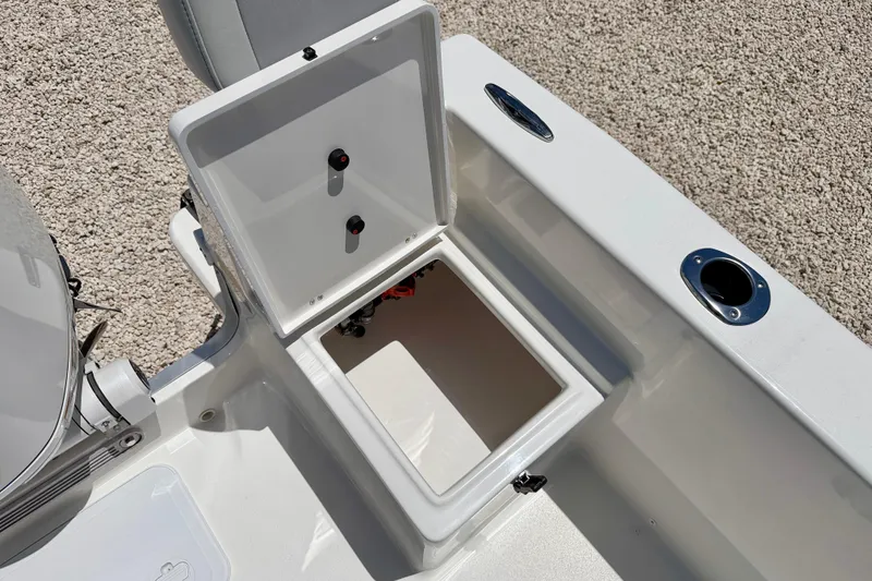 Slide: The Image of Open storage compartment on 2026 Bay Rider 21 Offshore boat, featuring sleek white design. - 28