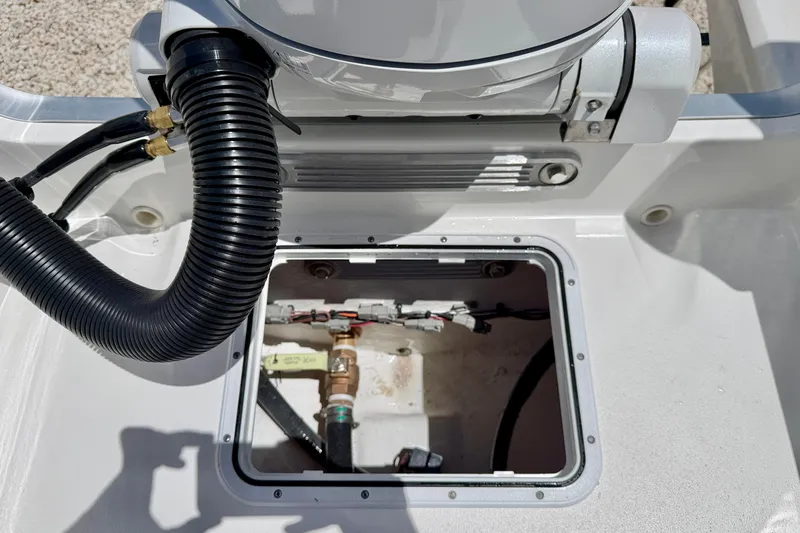 Slide: The Image of Bay Rider 21 Offshore 2026 boat compartment with hoses and wiring visible. - 30